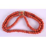 AN 18CT GOLD CARVED RED CORAL DOUBLE STRAND NECKLACE. 97 grams. 32 cm long.
