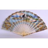 A MID 19TH CENTURY EUROPEAN IVORY AND BONE LADIES FAN printed and painted with figures dancing