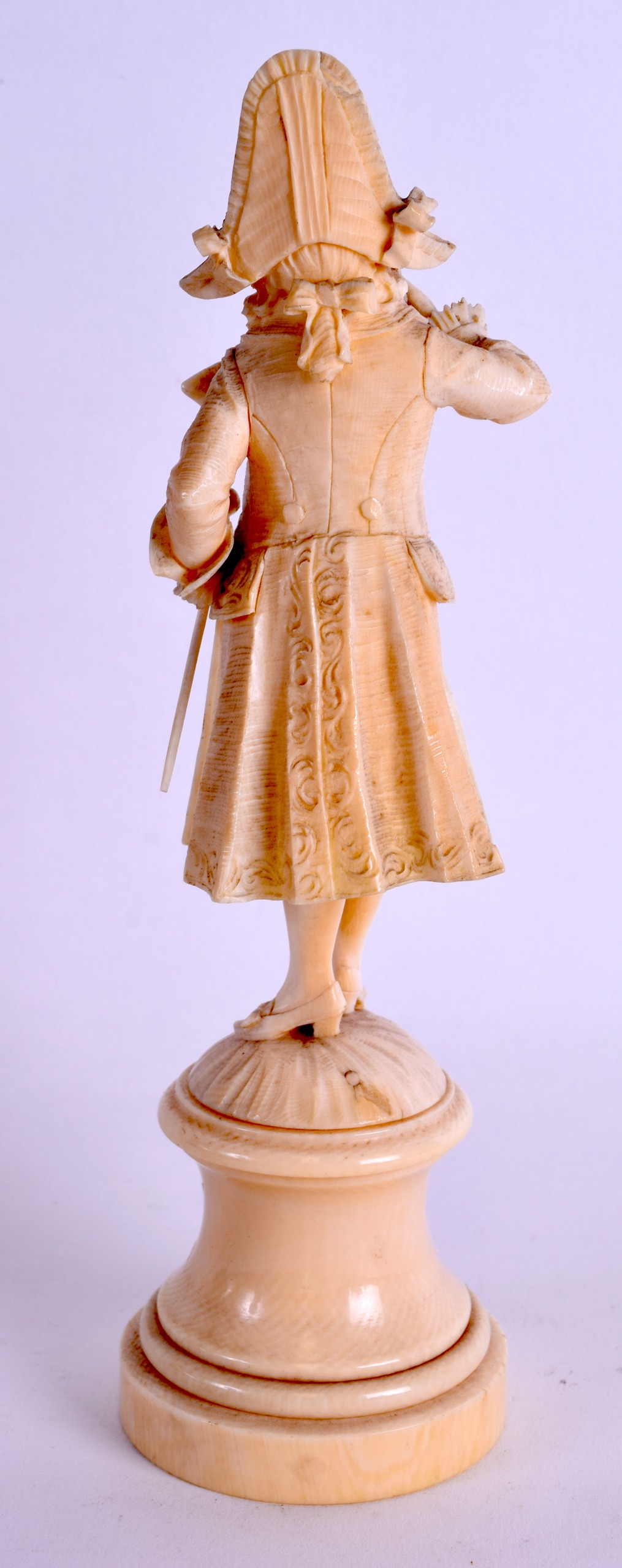 A MID 19TH CENTURY EUROPEAN CARVED IVORY FIGURE OF A DANDY modelled upon a circular base. 20 cm - Image 2 of 4