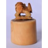 A LATE 19TH CENTURY CHINESE CARVED CANTON IVORY SEAL, the terminal in the form of a dog of foe. 4 cm