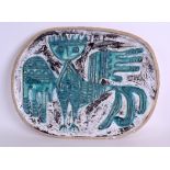 A LARGE 1950's RETRO STONEWARE POTTERY DISH in the manner of Picasso, decorated with a bold winged