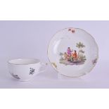 AN 18TH/19TH CENTURY MEISSEN PORCELAIN TEACUP AND SAUCER painted with figures within landscapes.