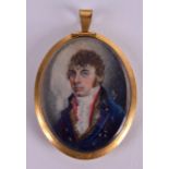 AN EARLY 19TH CENTURY EUROPEAN PAINTED IVORY PORTRAIT MINAITURE depicting a military male in blue