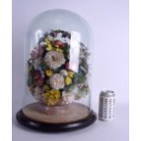 A LARGE EARLY VICTORIAN SHELL TAXIDERMY TYPE BASKET OF FLOWERS of unusual form within a glass