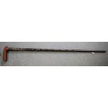 AN EARLY 20TH CENTURY INDIAN WOODEN WALKING STICK, formed with twist body and bone inlay. 86 cm.
