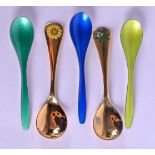 A LARGE PAIR OF DANISH SILVER GILT AND ENAMEL SPOONS together with three unusual silver and enamel