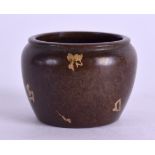 A SMALL CHINESE GOLD SPLASH BRONZE CENSER. 3.5 cm diameter.