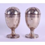 A PAIR OF VICTORIAN SILVER PEPPERETTES. London 1882. 4 oz. 8.5 cm high.