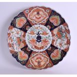 A 19TH CENTURY JAPANESE MEIJI PERIOD IMARI SCALLOPED PLATE painted with birds and foliage. 30 cm