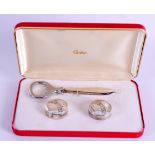 A CASED SET OF CARTIER PERRIER SILVER BOTTLE OPENER with two covers. (3)