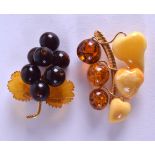 TWO RARE CARVED RUSSIAN AMBER BROOCHES. 20.3 grams. (2)