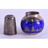 AN ANTIQUE SILVER THIMBLE together with a small silver and enamel pot. (2)