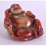 A CHINESE CARVED RED SOAPSTONE FIGURE OF A BUDDHA. 7 cm x 6 cm.