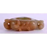 A CHINESE CARVED GREEN JADE BRUSH WASHER formed with two opposing figures. 9 cm x 6.75 cm.