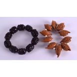 TWO CHINESE CARVED NUT BRACELETS. (2)