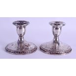 A PAIR OF VINTAGE FRENCH CARTIER SILVER CANDLESTICKS. 25 oz (loaded). 8.5 cm high.