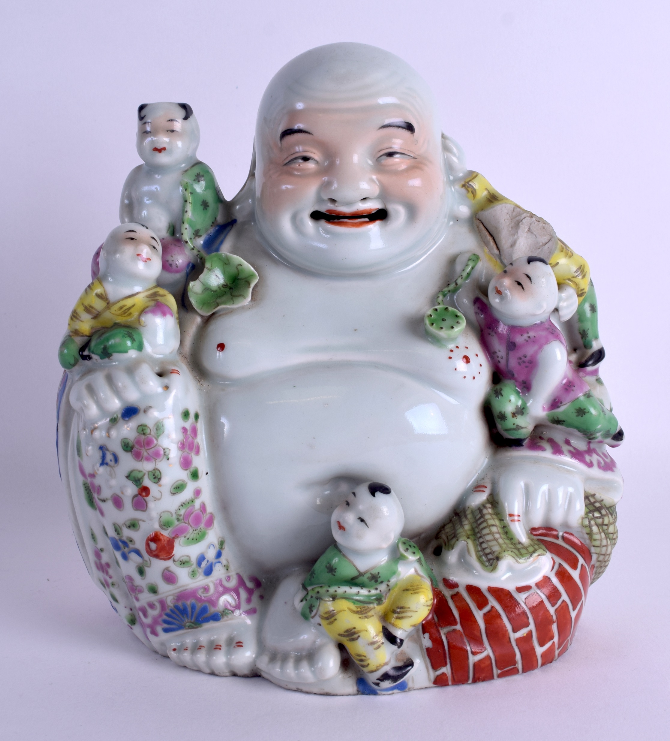 AN EARLY 20TH CENTURY CHINESE FAMILLE ROSE PORCELAIN FIGURE OF A BUDDHA modelled with five