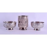 A LATE 19TH CENTURY INDIAN SILVER BEAKER together with two silver bowls. 6.3 oz. (3)