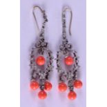 A PAIR OF 9CT GOLD SILVER AND CORAL EARRINGS.