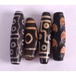 FOUR CHINESE CARVED AGATE ZHU BEADS. 6 cm long. (4)