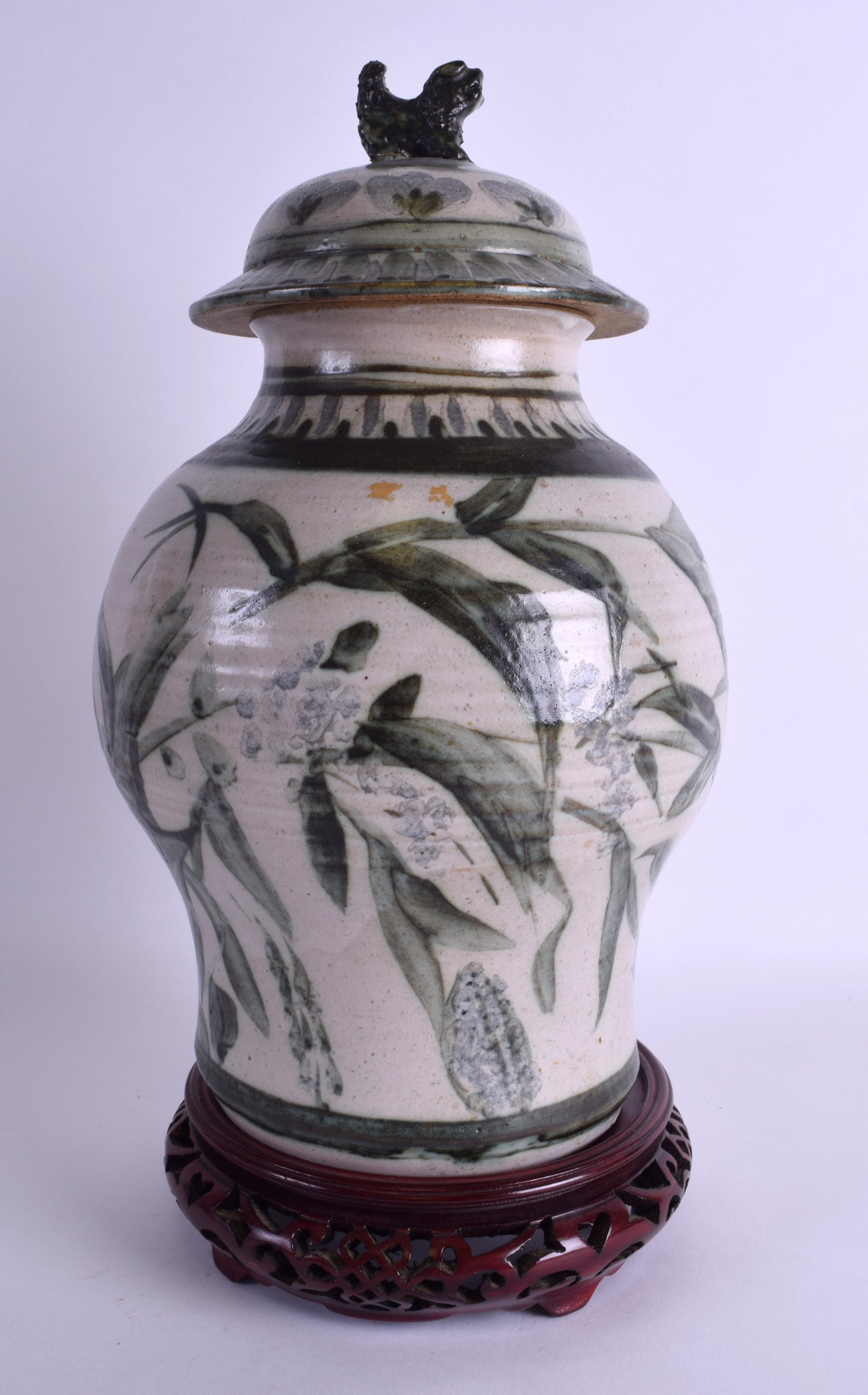 A CHINESE STUDIO POTTERY VASE AND COVER painted with floral sprays. 24 cm high.