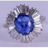 A STYLISH ART DECO WHITE GOLD DIAMOND AND SAPPHIRE RING of sunburst form, the faceted stone