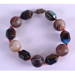 A VINTAGE CHINESE CARVED AGATE BRACELET.