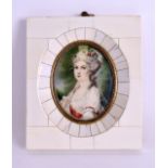 AN EARLY 20TH CENTURY CONTINENTAL CARVED IVORY PORTRAIT MINIATURE painted with a pretty female.