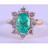 AN 18CT GOLD DIAMOND AND EMERALD FLOWER CLUSTER RING. Size K. 6.3 grams.
