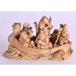 A GOOD 19TH CENTURY JAPANESE MEIJI PERIOD CARVED IVORY OKIMONO modelled as immortals upon a boat.