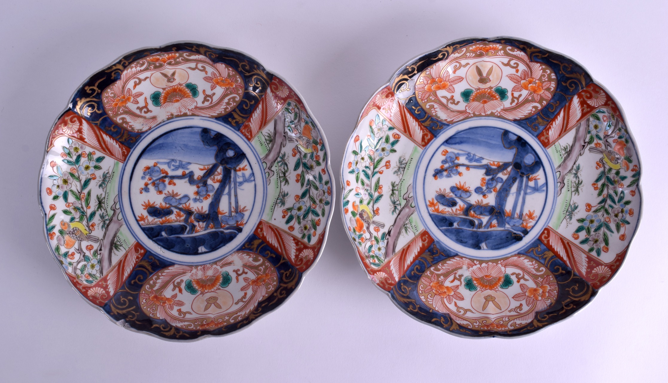 A PAIR OF 19TH CENTURY JAPANESE MEIJI PERIOD IMARI SCALLOPED DISHES painted with floral sprays and