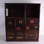 AN EARLY 20TH CENTURY JAPANESE MEIJI PERIOD HARDWOOD AND LACQUER DISPLAY CABINET with sliding doors.