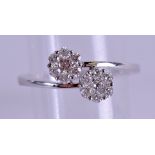 A STYLISH 18CT DIAMOND DOUBLE FLOWER RING approx. 0.5 ct overall. 2.9 grams. Size M/N.