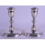 A PAIR OF MODERN ENGLISH SILVER HALLMARKED CANDLESTICKS. 38 oz loaded. 17.5 cm high.