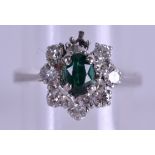 A GOLD EMERALD AND DIAMOND FANCY RING approx. 0.4 ct of diamond. 3.7 grams. Size M/N.