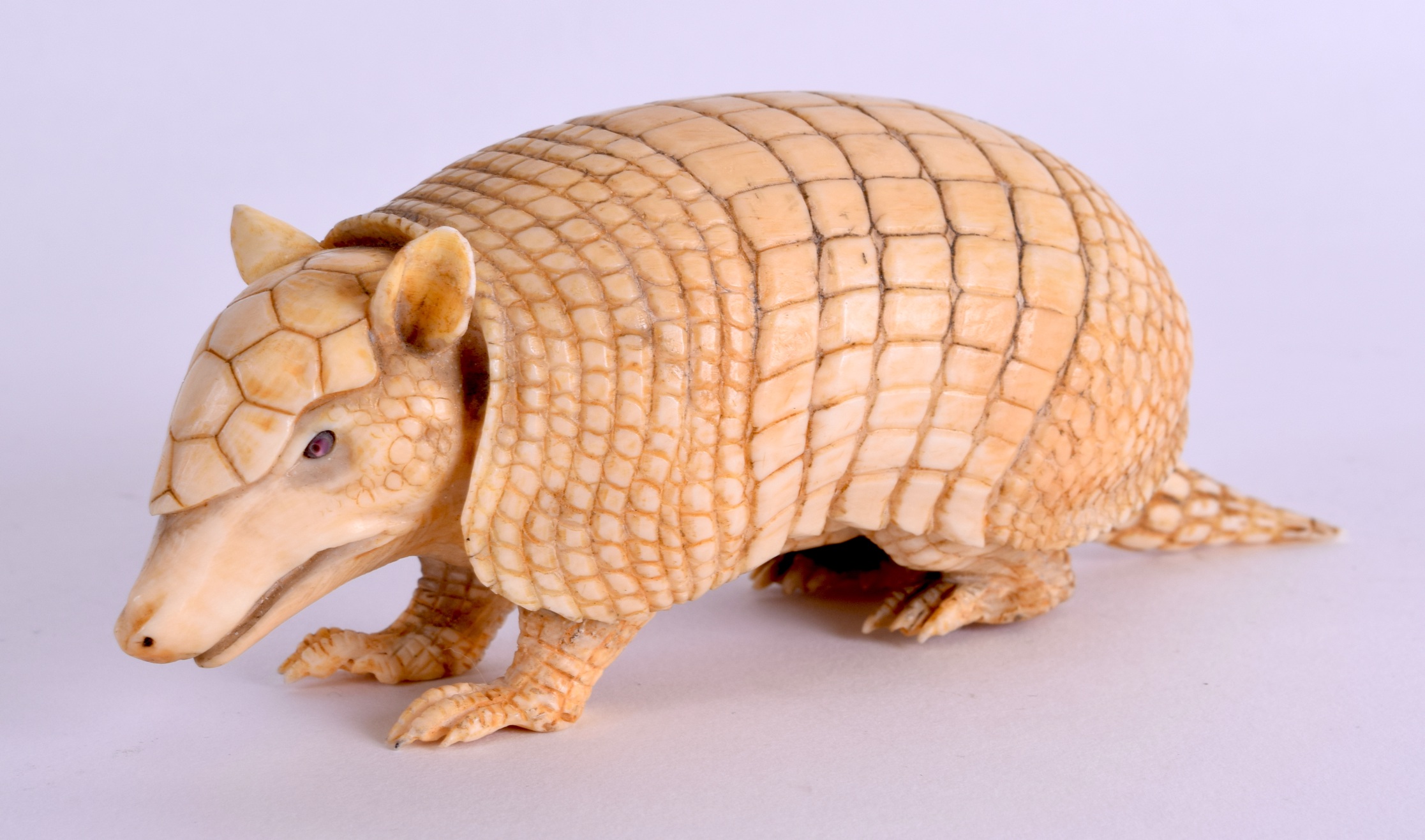 A VERY RARE 19TH CENTURY JAPANESE MEIJI PERIOD CARVED IVORY ARMADILLO naturalistically modelled in a