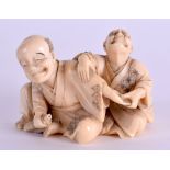A 19TH CENTURY JAPANESE MEIJI PERIOD CARVED IVORY OKIMONO modelled as a male holding another males