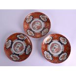 A SET OF THREE 19TH CENTURY JAPANESE MEIJI PERIOD IMARI PLATES painted with birds within shaped