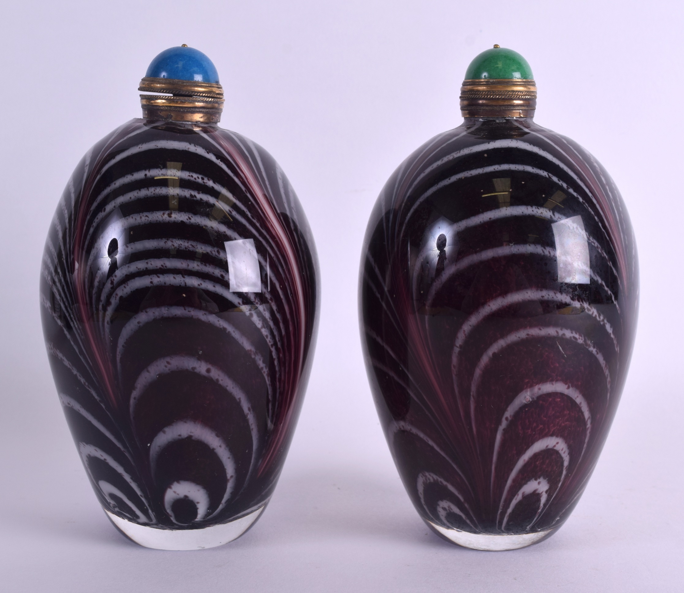 A LARGE PAIR OF CHINESE ART GLASS SCENT BOTTLE AND STOPPERS with swirling design. 19 cm x 8 cm.