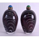 A LARGE PAIR OF CHINESE ART GLASS SCENT BOTTLE AND STOPPERS with swirling design. 19 cm x 8 cm.