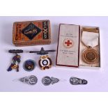 FOUR ENAMEL MILITARY BADGES and a Red Cross medal. (qty)