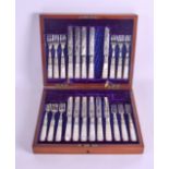 A CASED EDWARDIAN SILVER PLATED MOTHER OF PEARL CUTLERY SET with engraved blades.