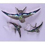 A SILVER ENAMEL SWALLOW BROOCH with matching earrings. (3)