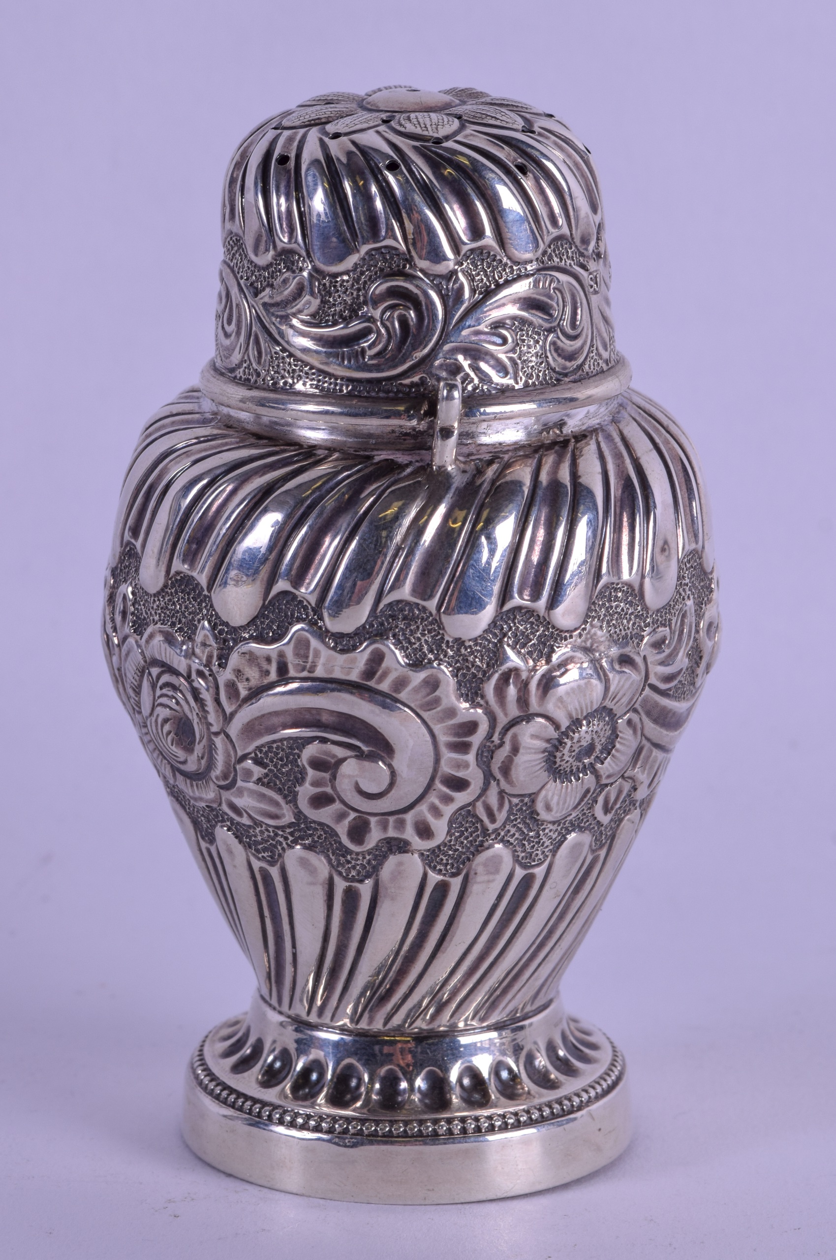 A LATE VICTORIAN EMBOSSED SILVER PEPPER POT. London 1892. 4 oz. 12 cm high. - Image 2 of 4