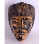 A FINE 18TH/19TH CENTURY SOUTH EAST ASIAN POLYCHROMED MASK unusually well modelled with carved