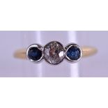 A STYLISH 18CT GOLD DIAMOND AND SAPPHIRE RING the diamond approx. 0.5 ct. 4.4 grams. Size N/O.