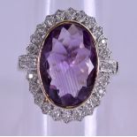 AN 9CT GOLD AMETHYST AND DIAMOND RING. Size Q.