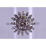 AN 18CT GOLD AND DIAMOND CLUSTER FANCY RING approx. 1ct overall. 2.8 grams. Size L.