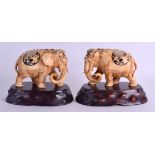 A GOOD PAIR OF 19TH CENTURY JAPANESE MEIJI PERIOD CARVED IVORY ELEPHANTS decorated in shibayma inlay