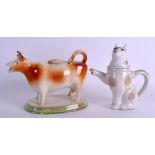 A LATE 19TH CENTURY CONTINENTAL COW CREAMER AND COVER together with a novelty teapot in the form